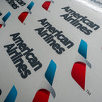 Multiple American Airlines logo stickers arranged on a surface