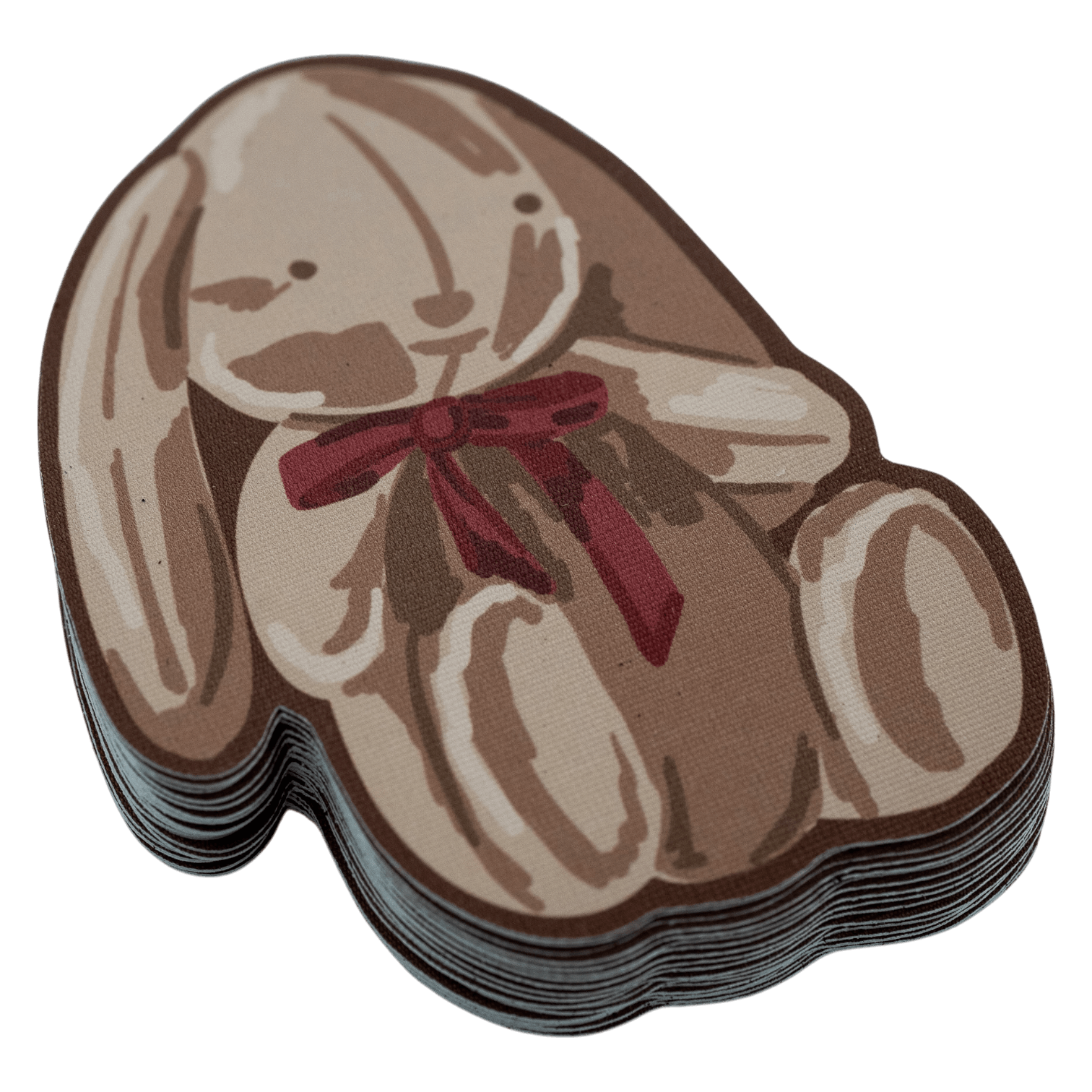 Stack of die-cut fabric stickers shaped like a sitting bunny with a red bow, illustrated in brown and tan tones