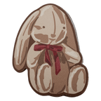 Fabric sticker shaped like a sitting bunny with long floppy ears and a red bow, in soft brown and cream tones
